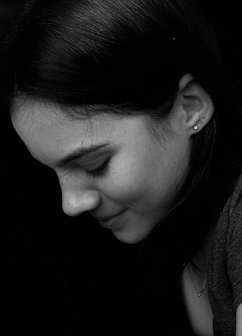 grayscale photo of womans face