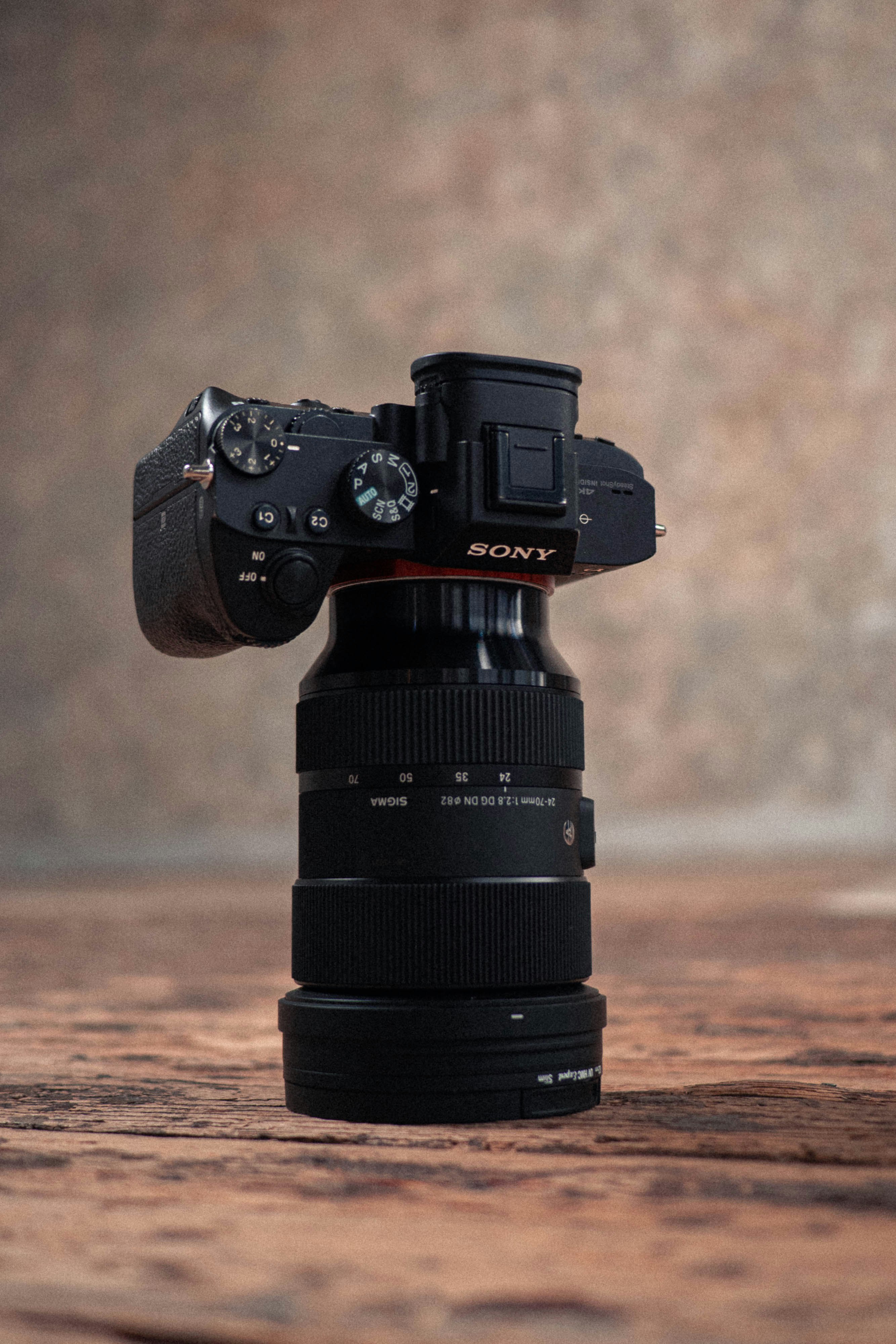 black nikon dslr camera on brown sand