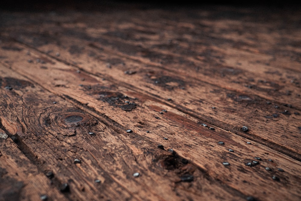 water droplets on brown wooden surface