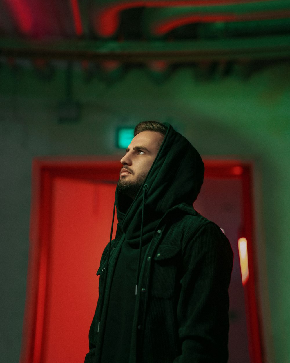 man in black hoodie standing