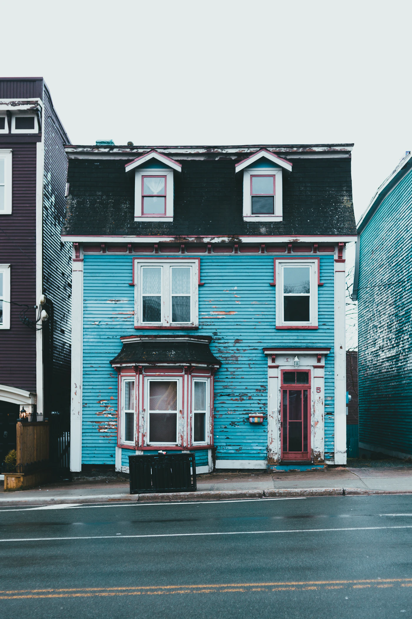 An old blue saltbox house on an overcast day in St. John's, Newfoundland and Labrador