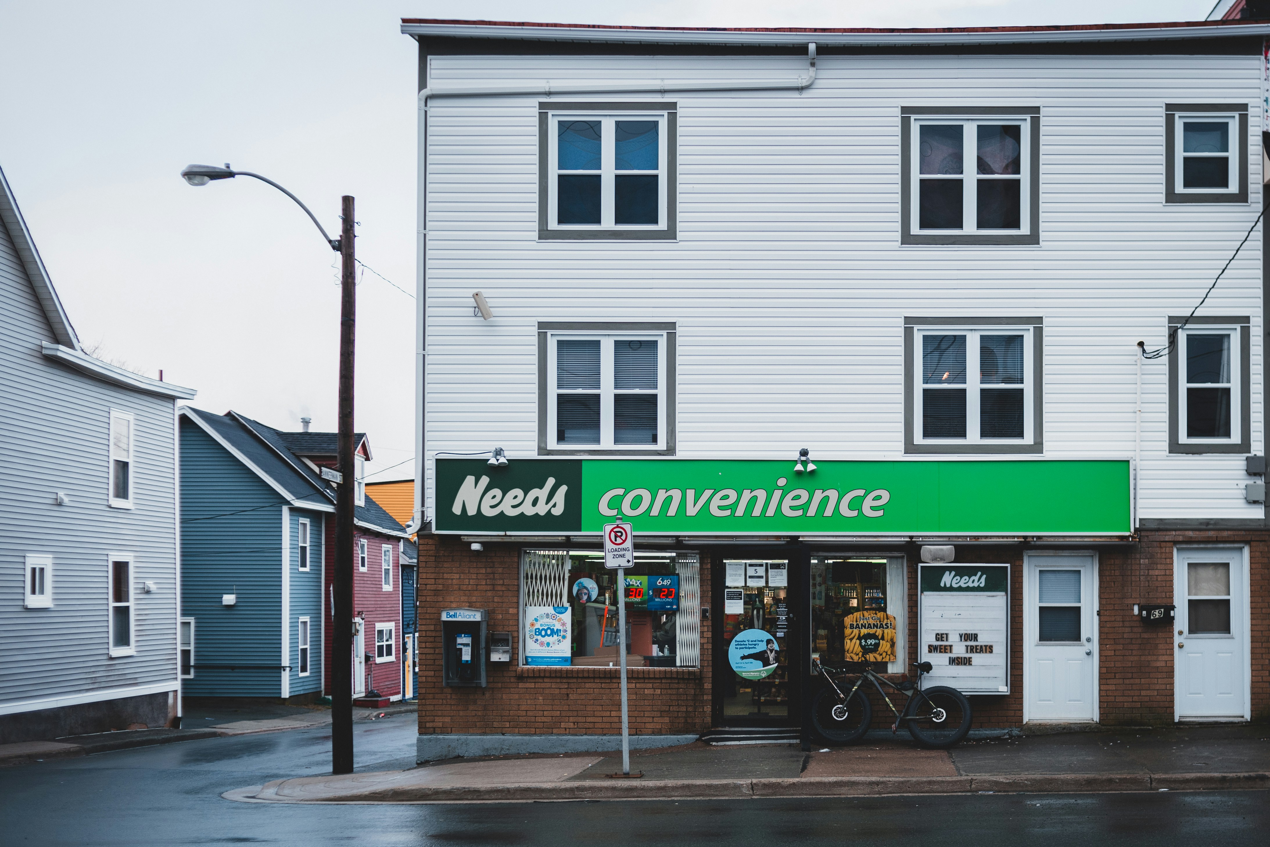 white and green store front during daytime