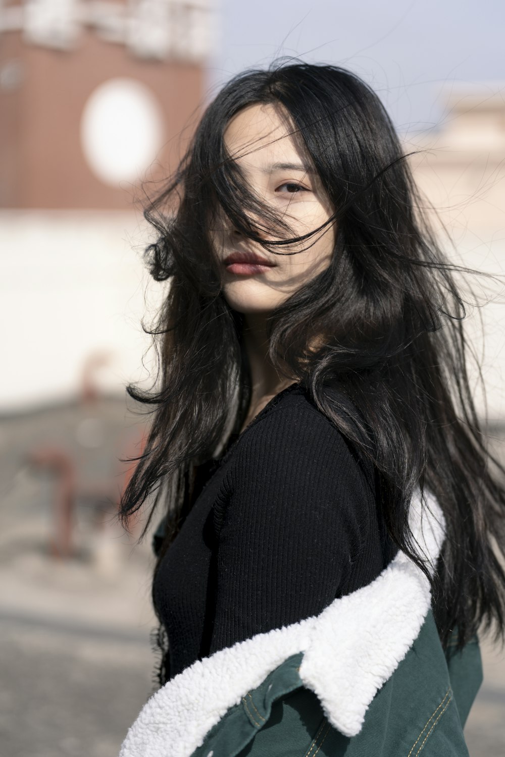 woman in black cardigan smiling