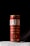 A single can of Brahma Duplo Malte beer prominently displayed against a dark background. The can is red with white and gold text, with droplets of condensation visible, suggesting it is cold.