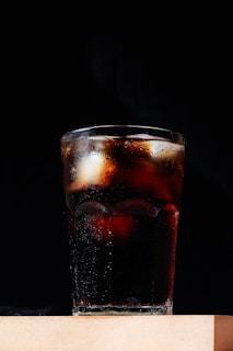 clear drinking glass with red liquid