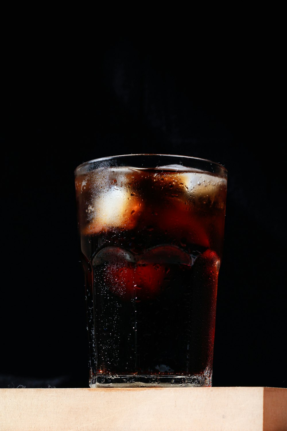 clear drinking glass with red liquid