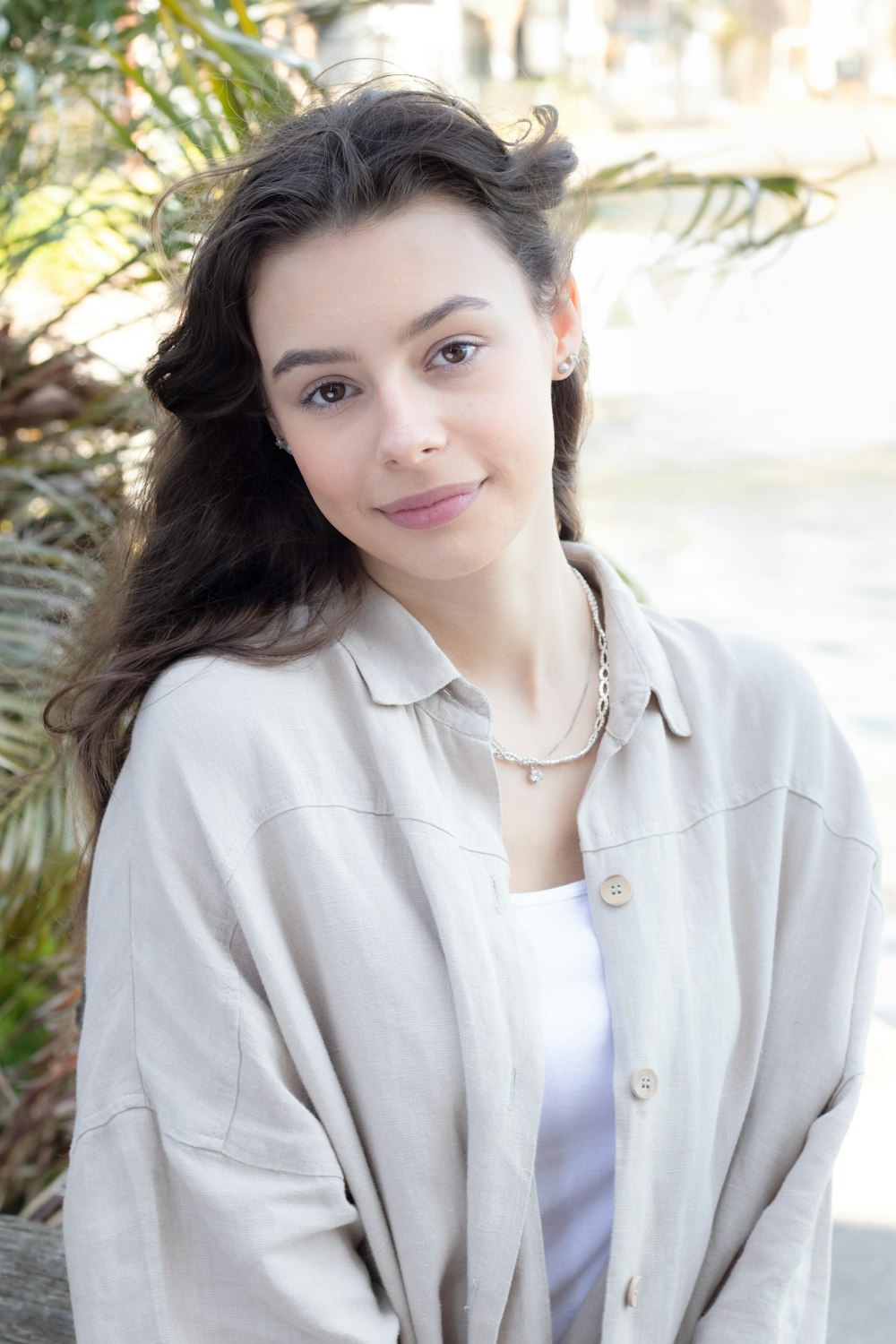 woman in white button up long sleeve shirt