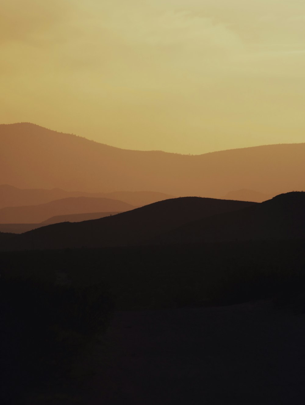 silhouette of mountains during sunset