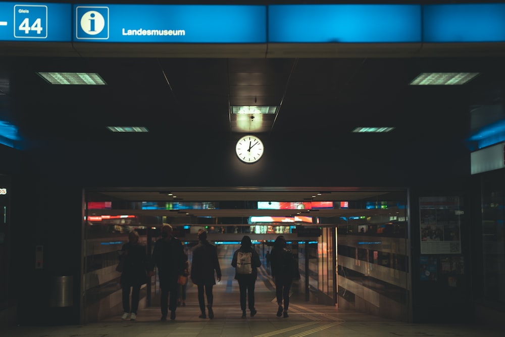 people walking on street during nighttime