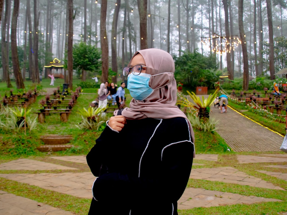 woman in black long sleeve shirt and white hijab