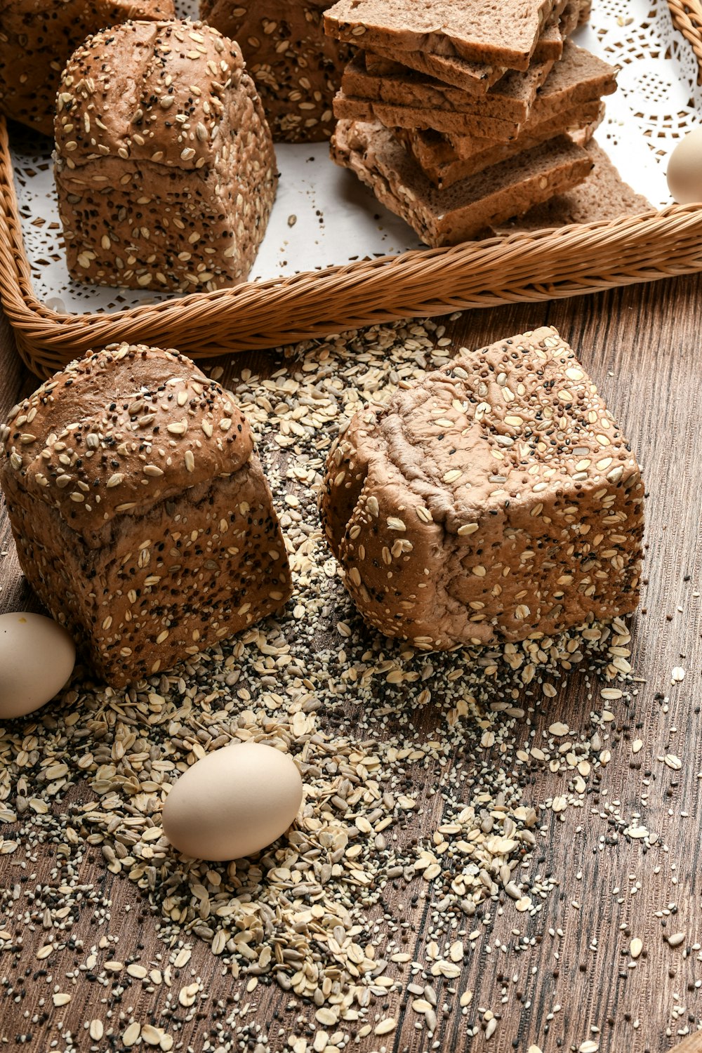 white egg beside brown bread on brown wooden table