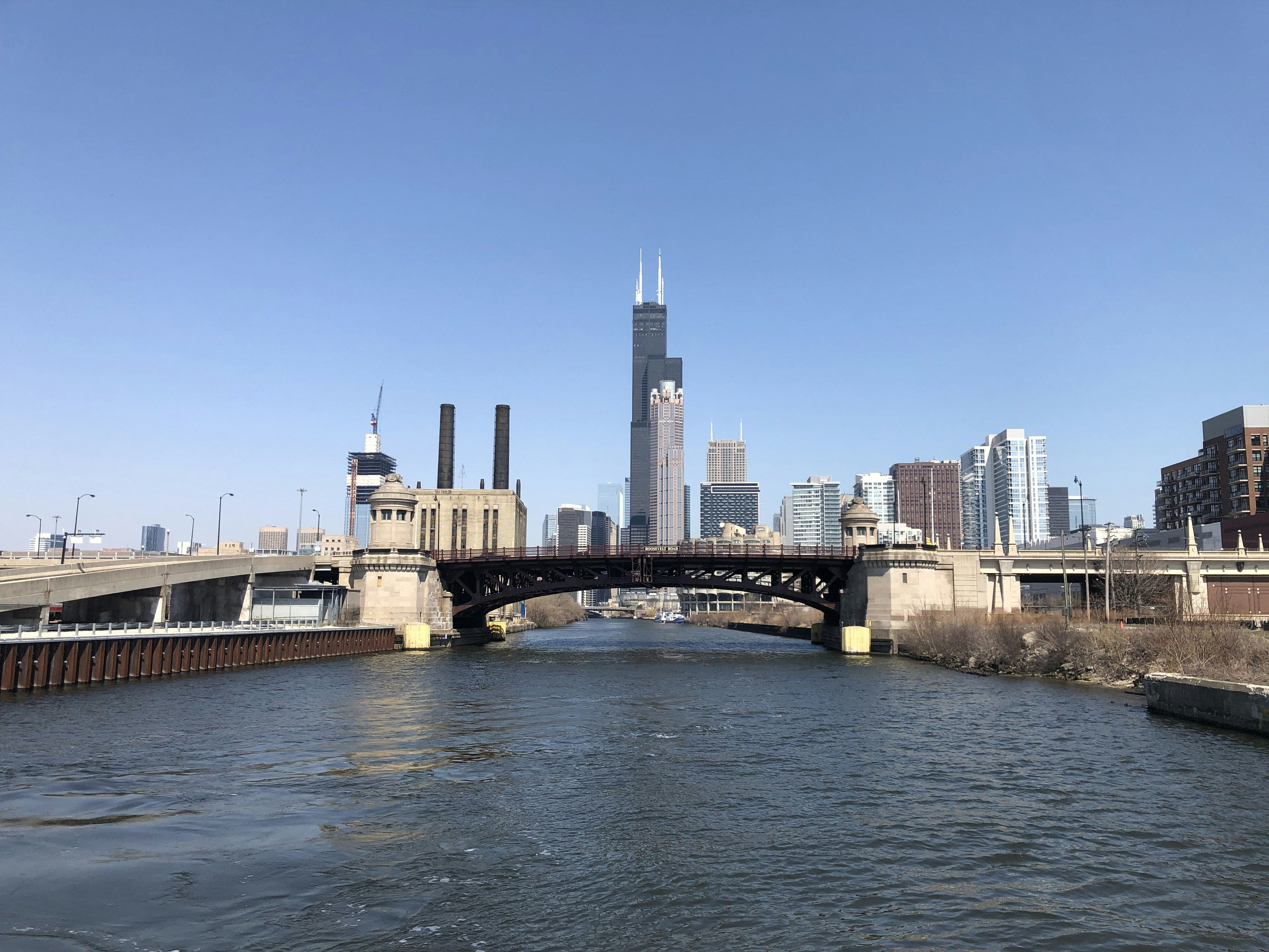 brown concrete bridge over river during daytime