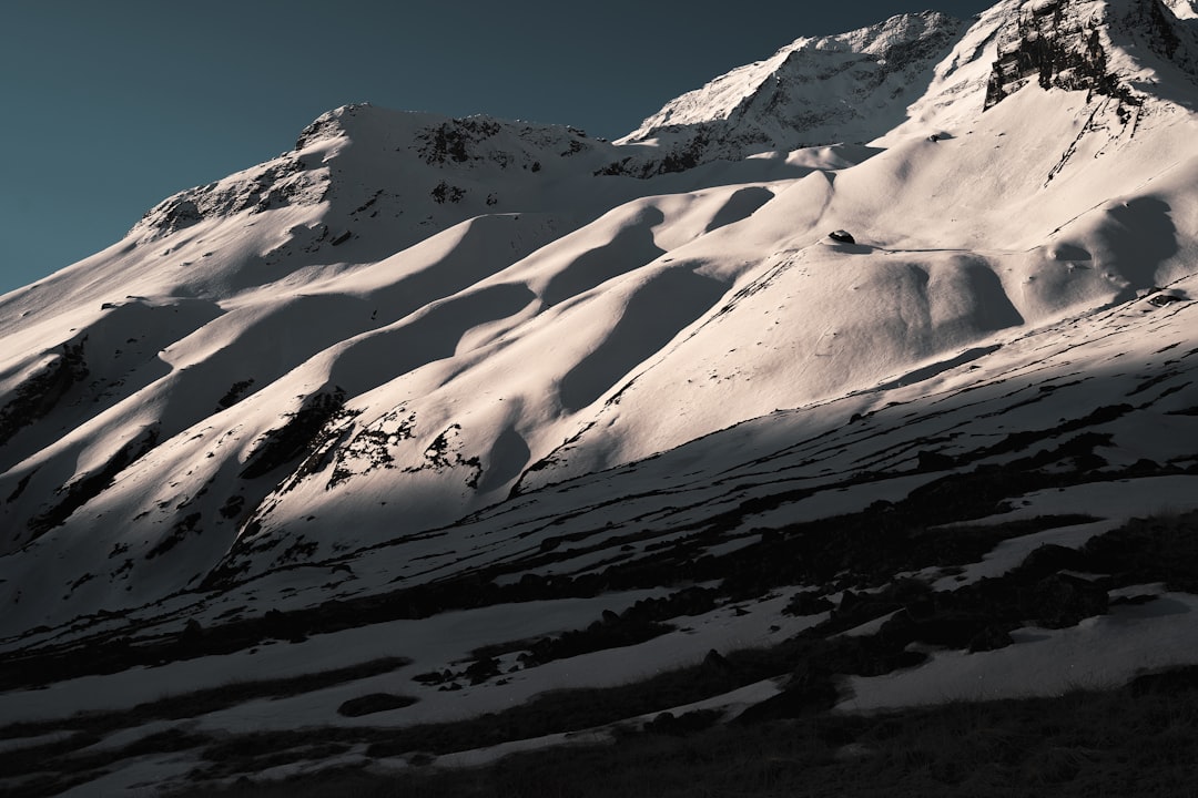 snow covered mountain during daytime