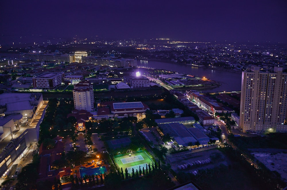 city with high rise buildings during night time