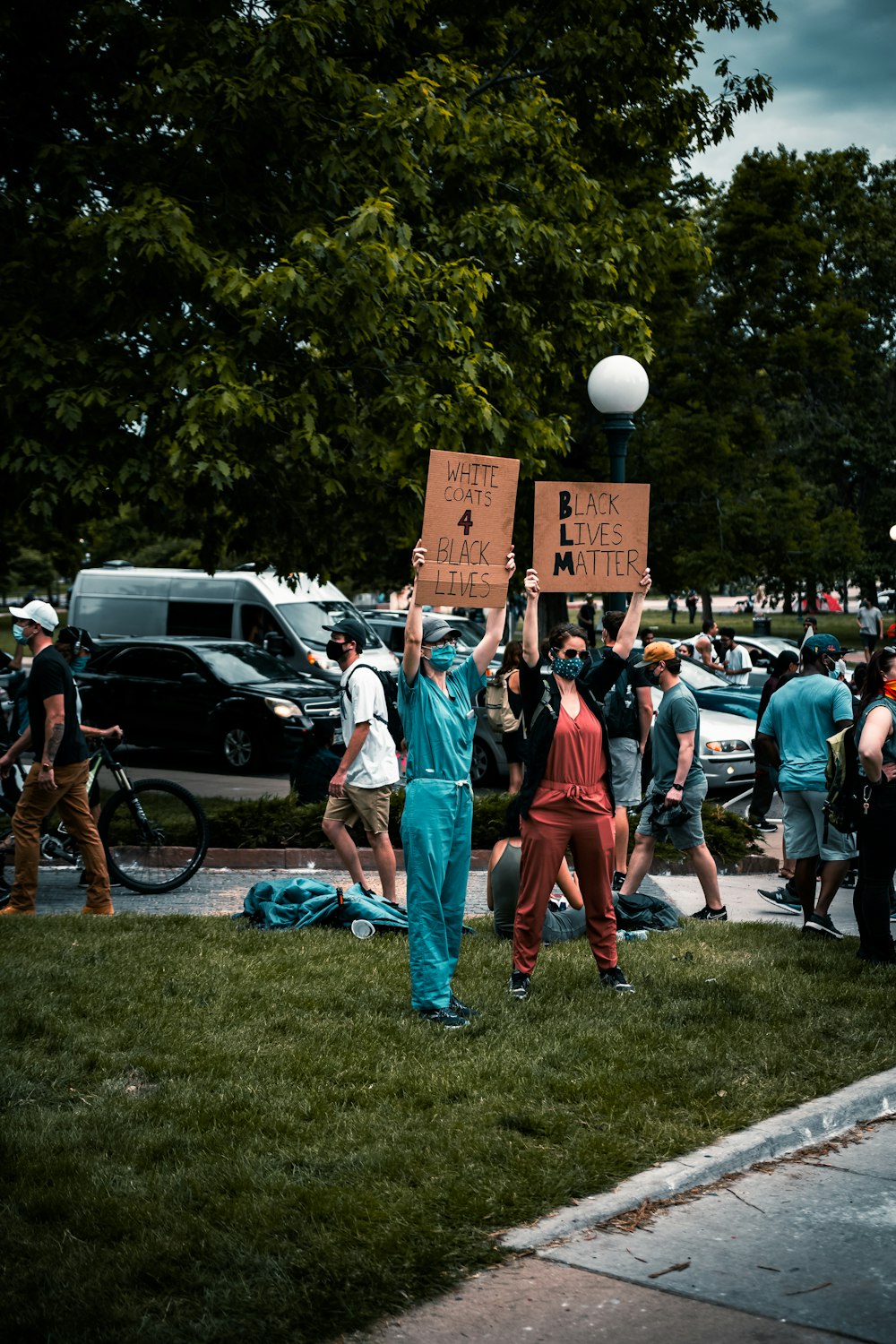 people standing on green grass field during daytime