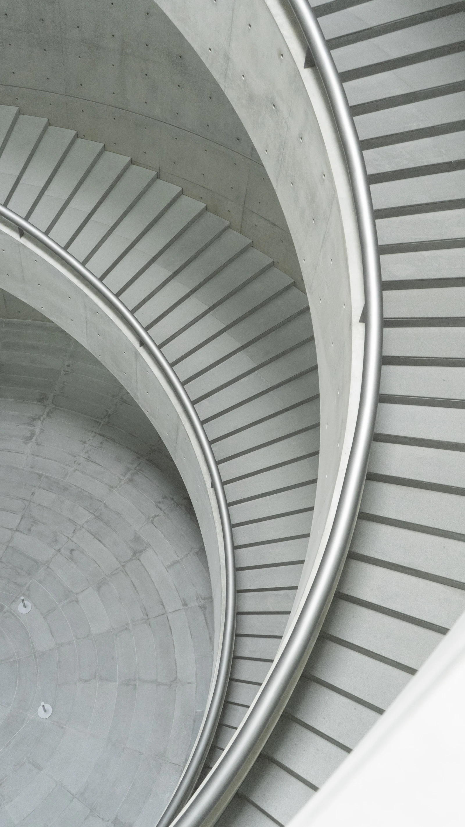 White spiral staircase in close up photography