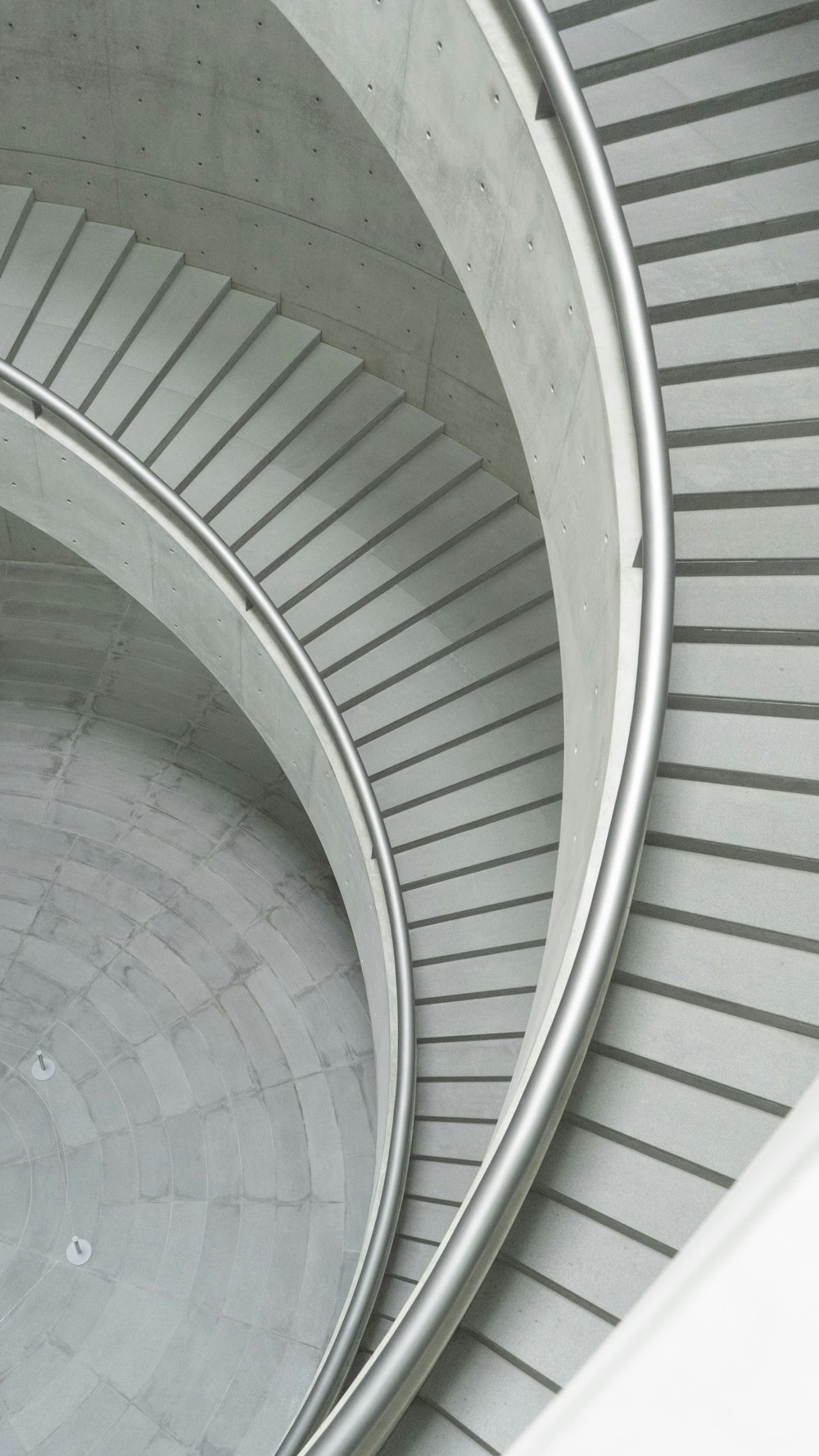 white spiral staircase in close up photography