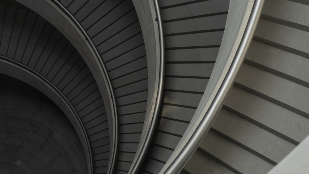 white spiral staircase with white metal railings