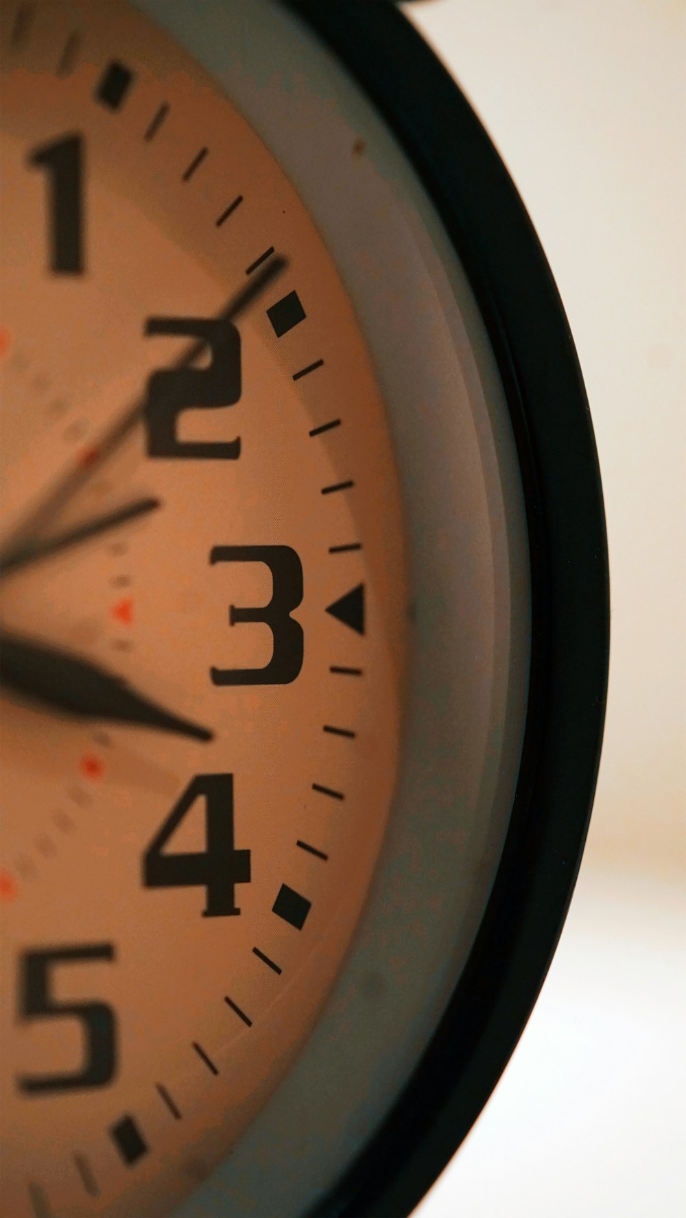 black and brown analog wall clock