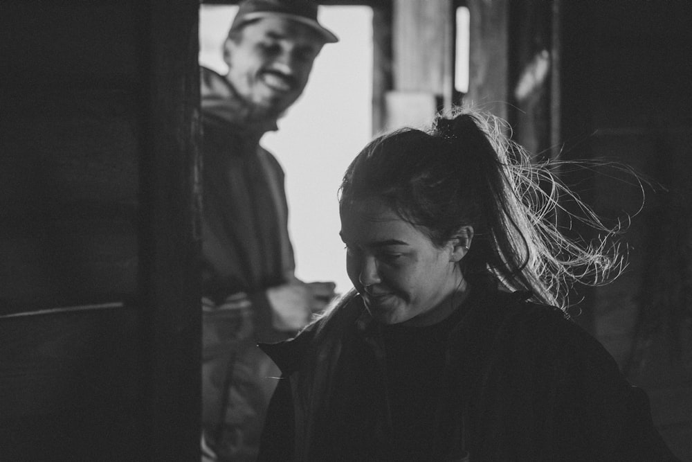 grayscale photo of woman in black jacket