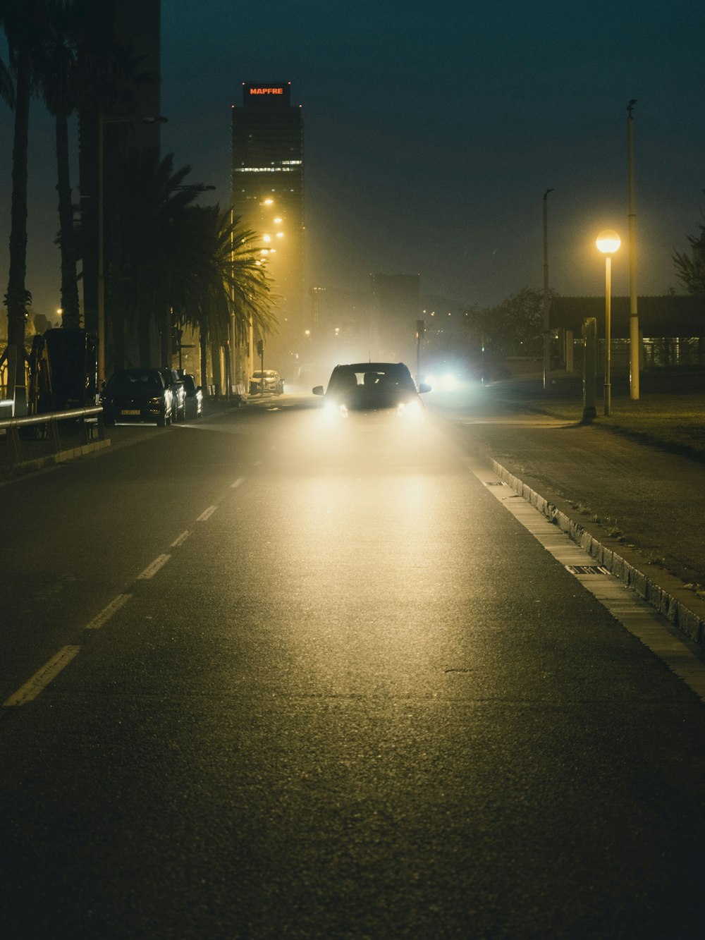 black car on road during night time