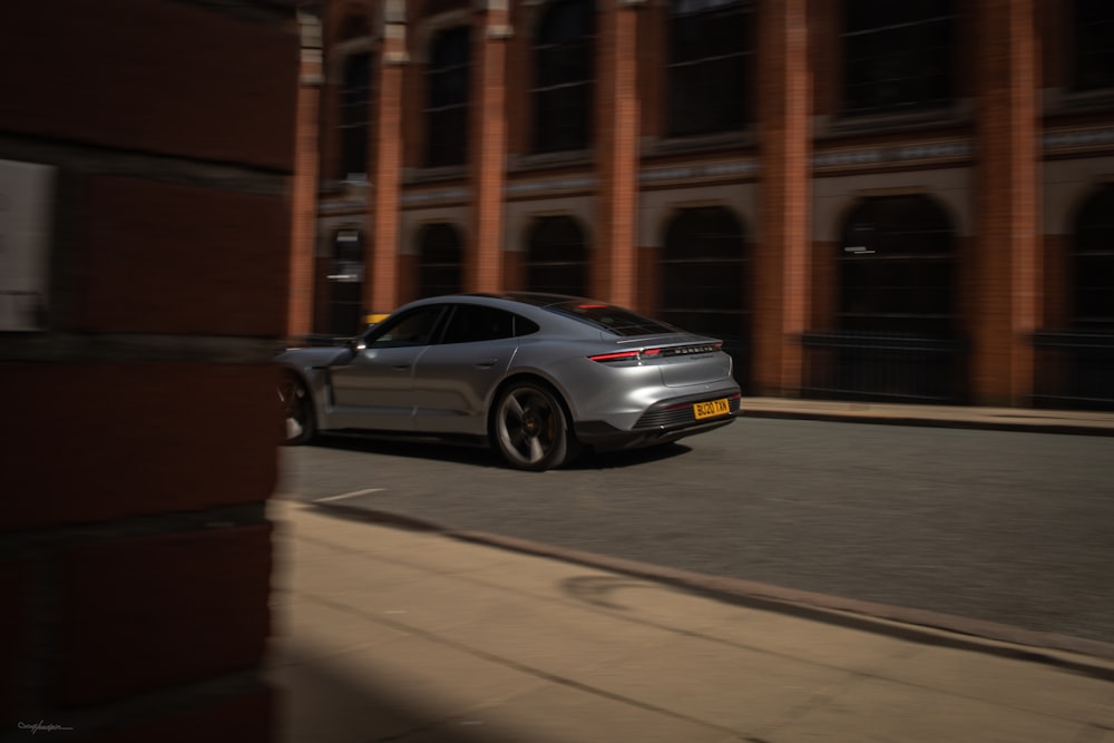 black sedan on road during daytime