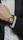 Close-up of a wristwatch being carefully examined by a skilled technician.