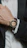 Close-up of a wristwatch being carefully examined by a skilled technician.
