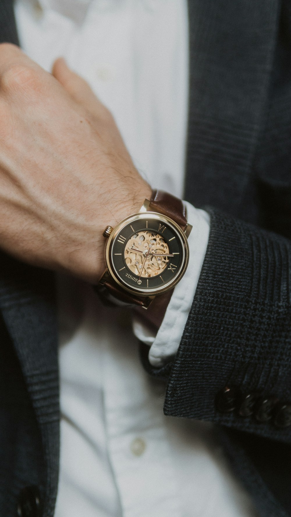 person wearing silver and gold chronograph watch