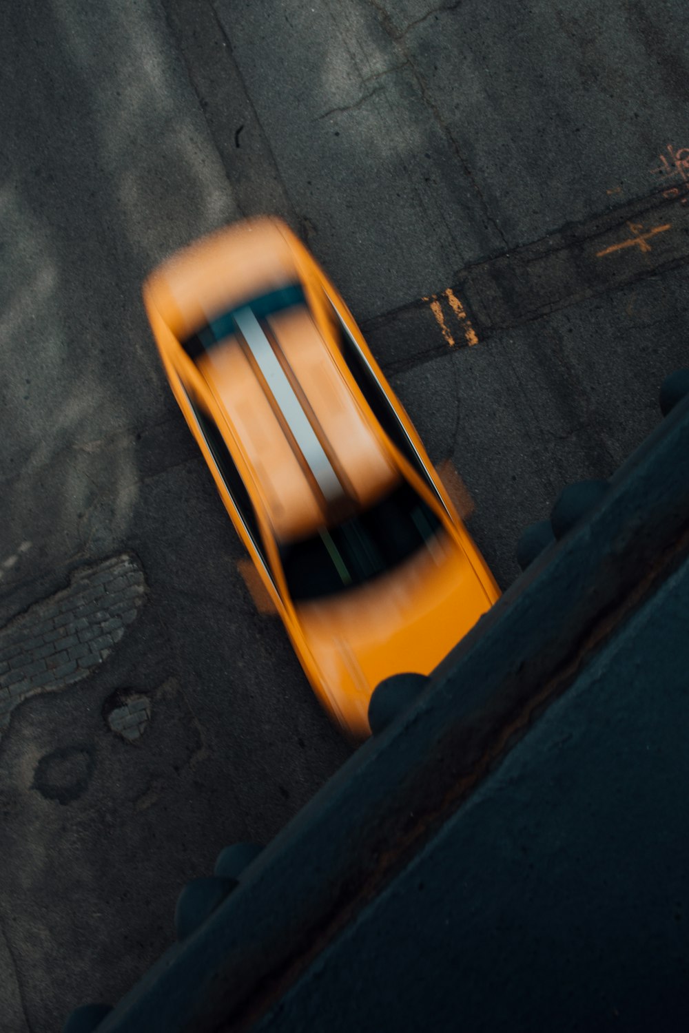 yellow and black slide on gray concrete floor