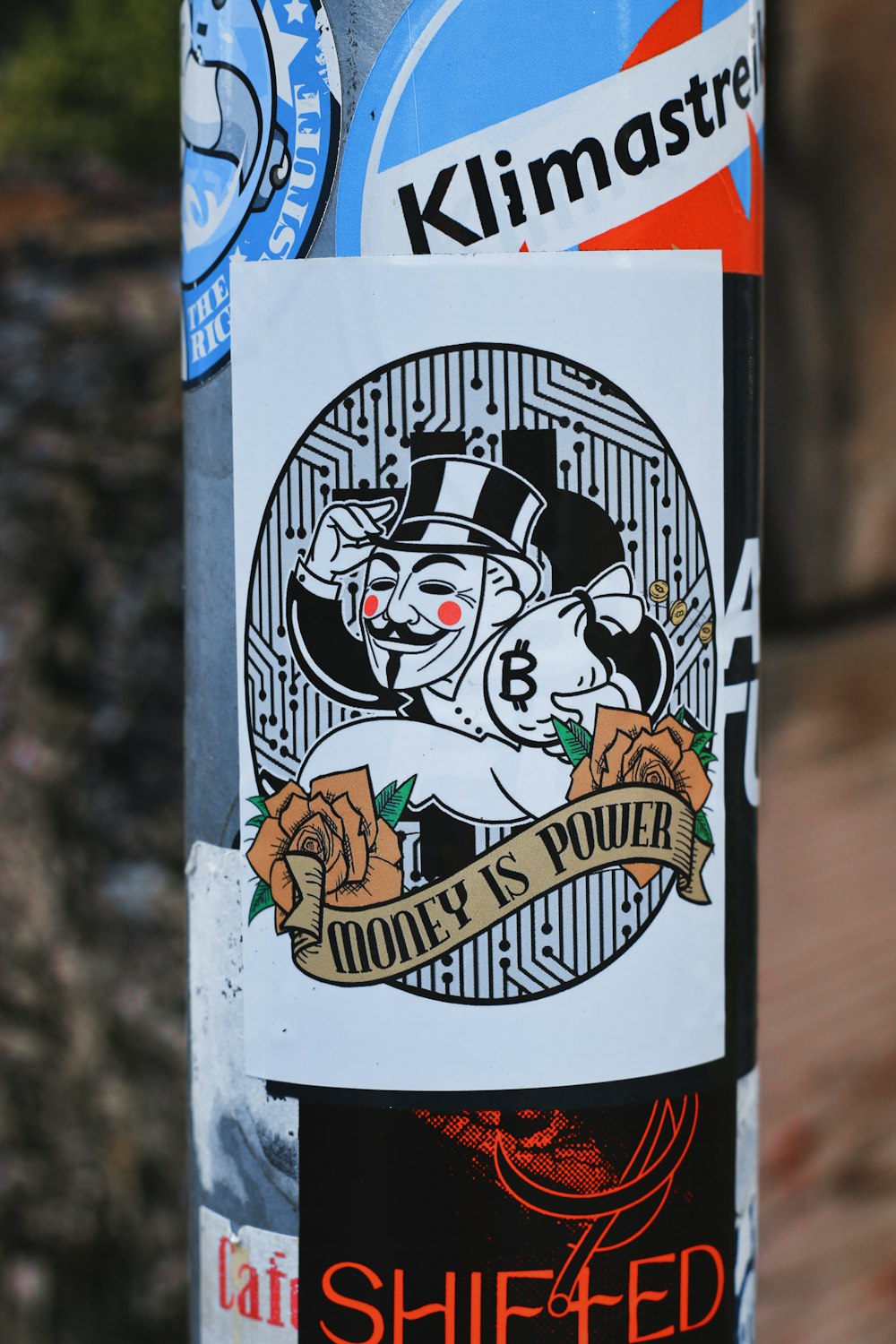 a close up of a sticker on a pole