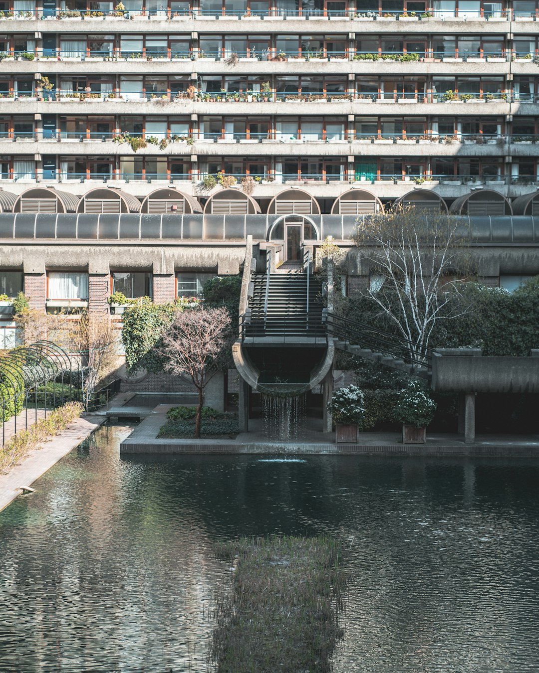 brown concrete building near river during daytime