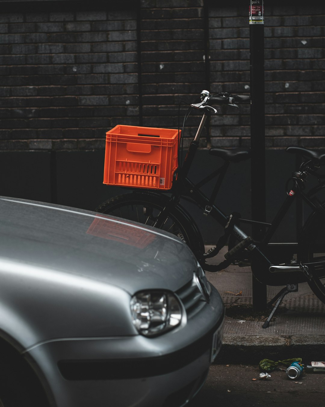 red plastic crate on gray car