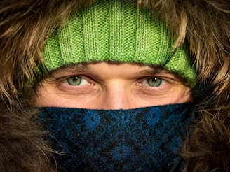 Close-up of the soft fleece lining inside a warm, olive green parka jacket.