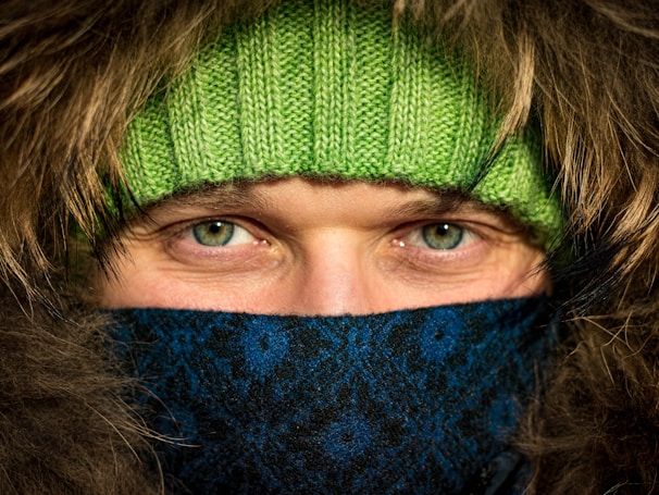 Close-up of the soft fleece lining inside a warm, olive green parka jacket.