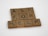 Wooden Scrabble tiles spell out the phrase 'ASK FOR HELP' arranged neatly on a white surface. Each tile shows a letter and a number indicating its point value in the game.