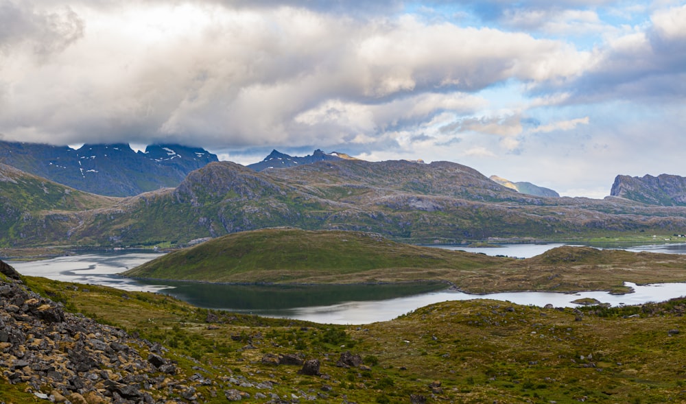 green and brown mountains under white clouds during daytime