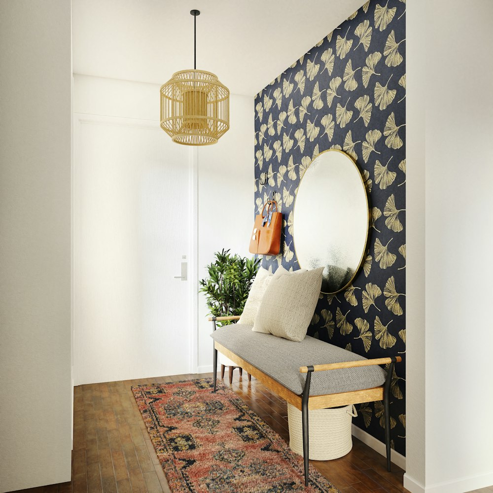 brown wooden framed white padded armchair beside brown wooden table