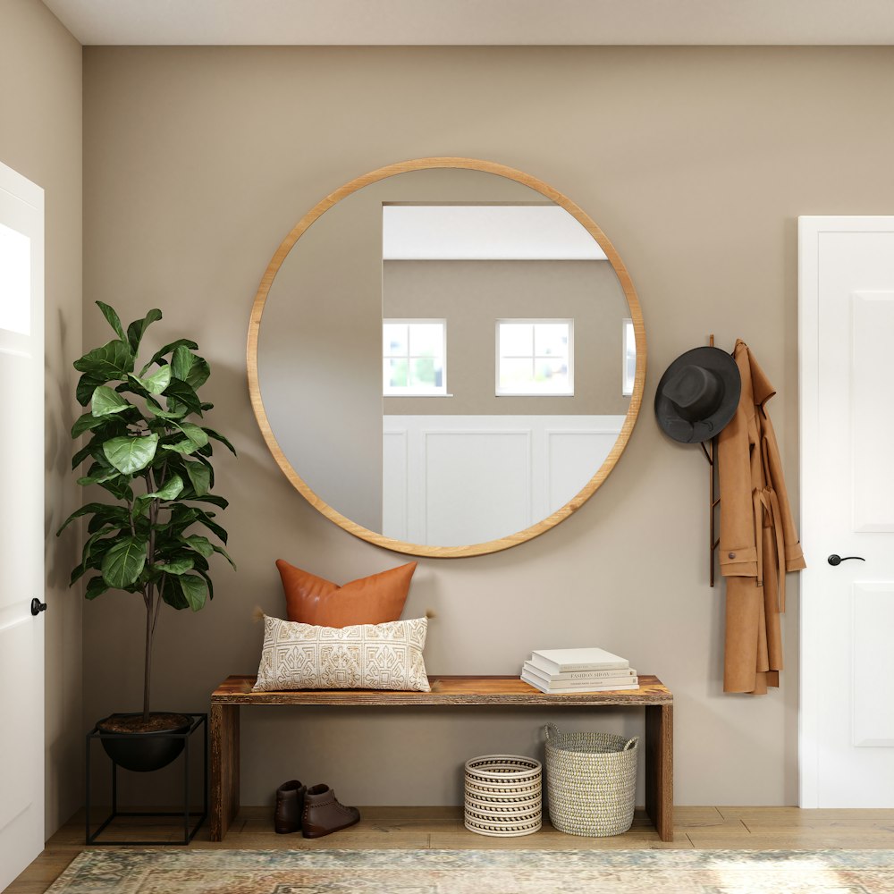 brown wooden framed mirror on white wall