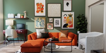 orange and black sofa with throw pillows