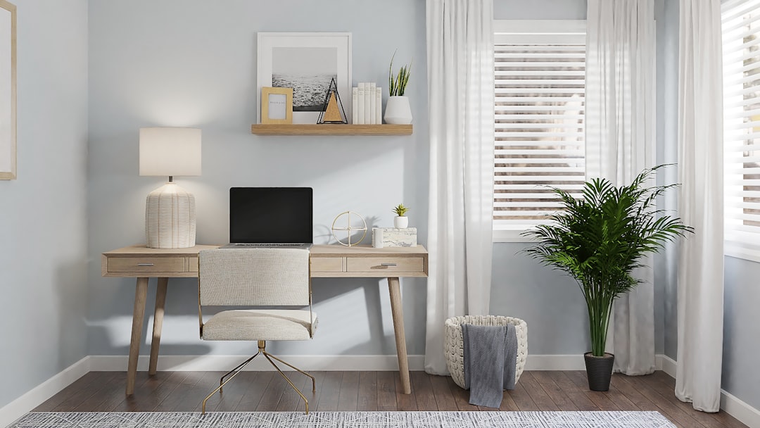 silver imac on brown wooden table