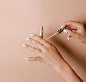 person holding white cigarette stick
