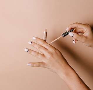 person holding white cigarette stick