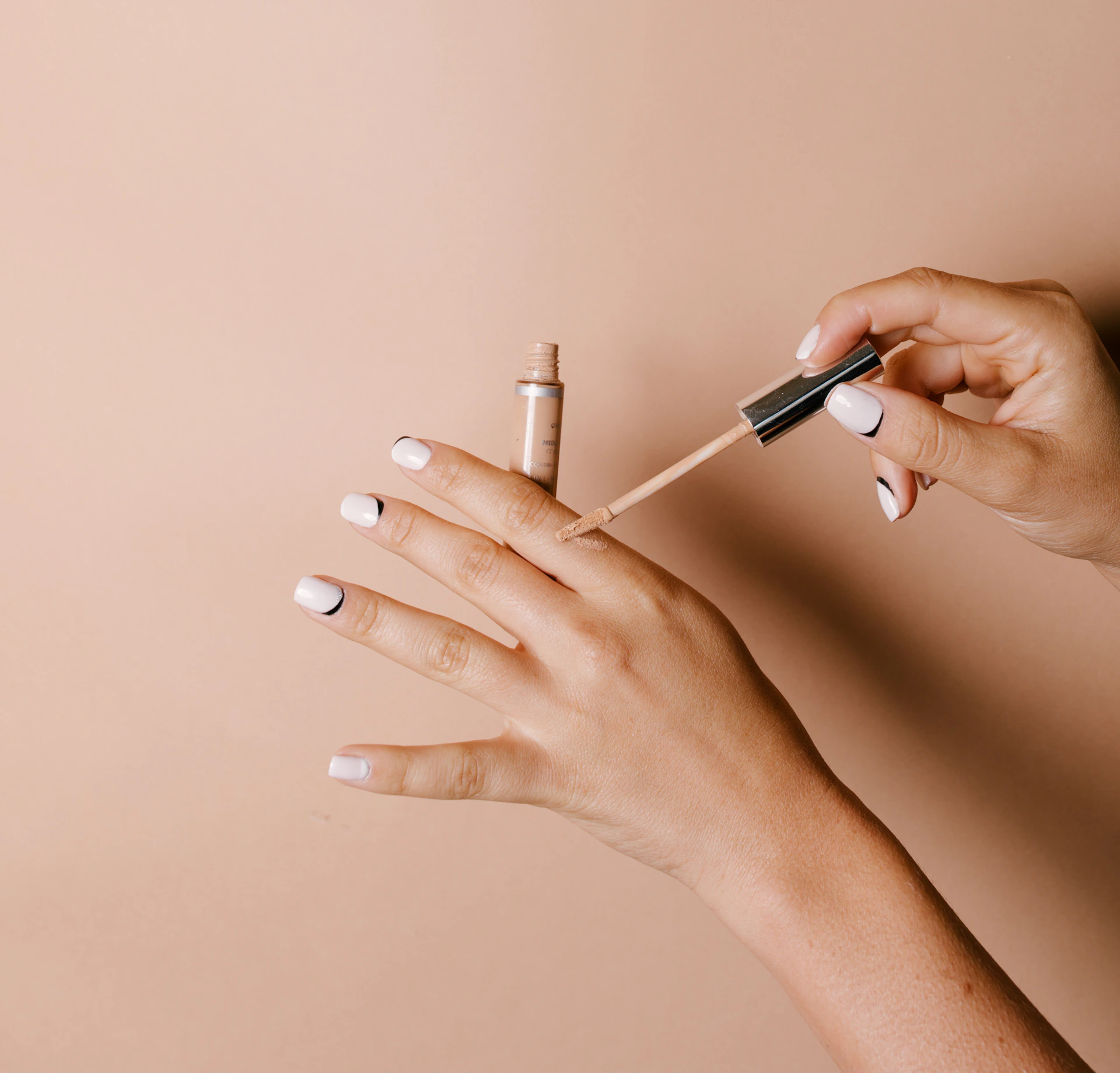 person holding white cigarette stick