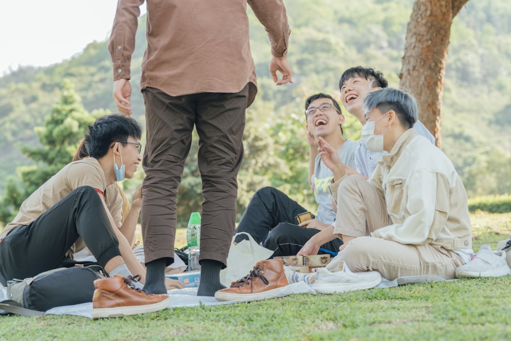 group of people doing yoga during daytime