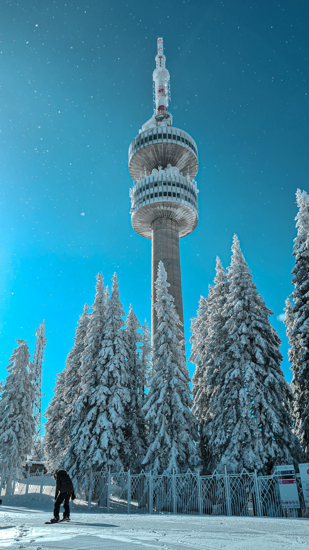 white concrete tower under blue sky during daytime