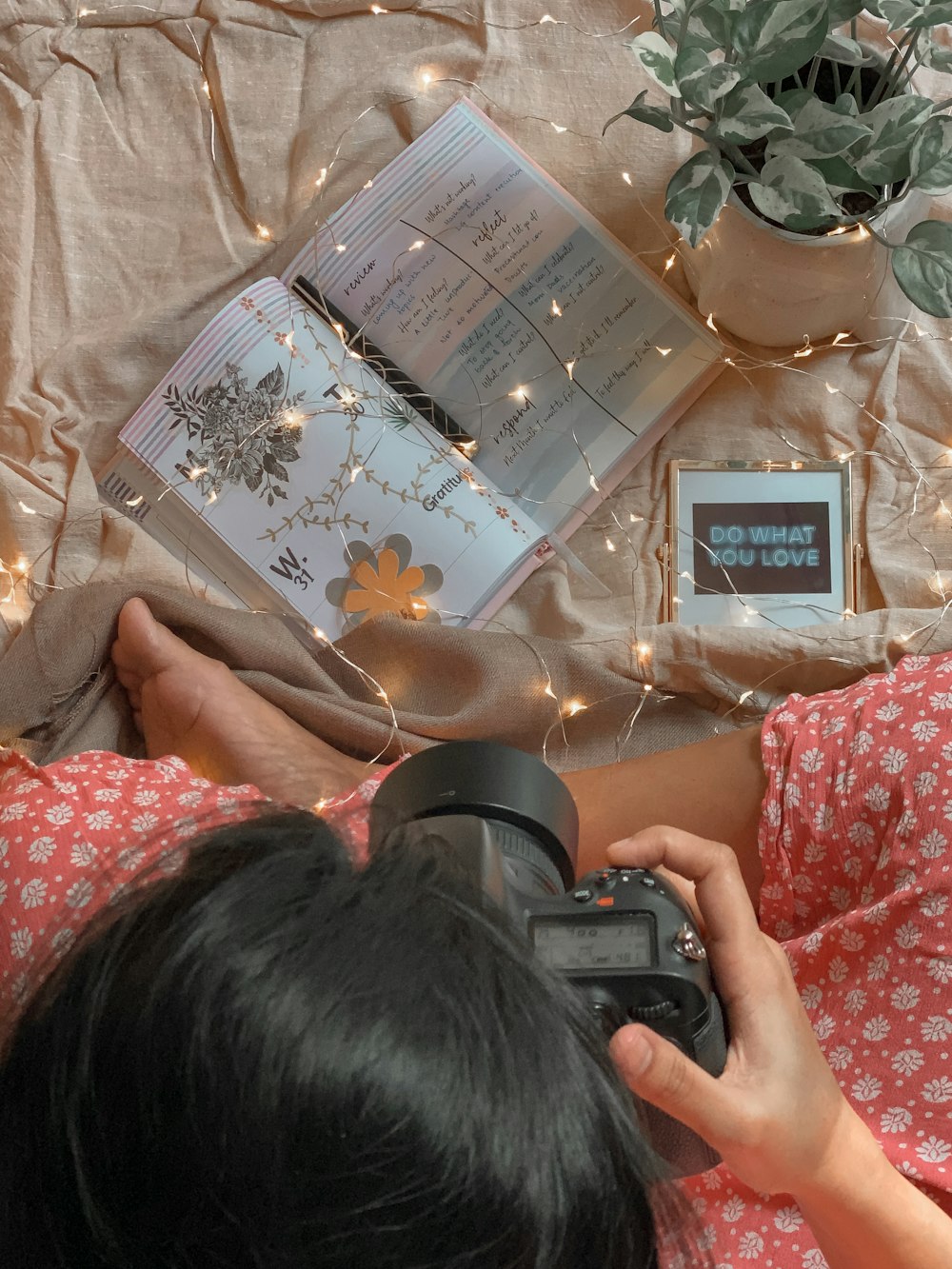 person holding black and silver digital camera