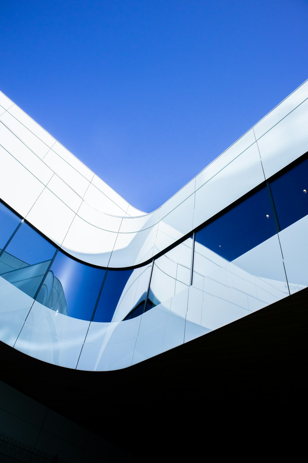 white concrete building under blue sky during daytime