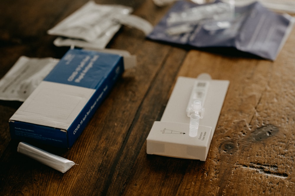 blue and white box on brown wooden table