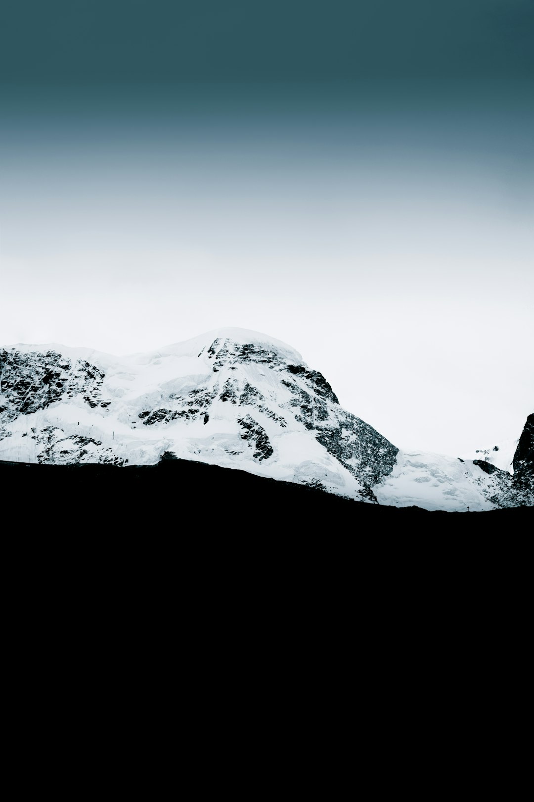 snow covered mountain during daytime